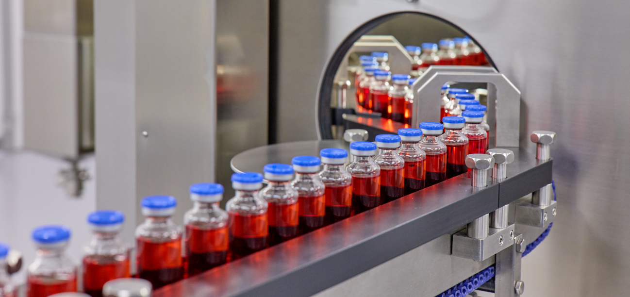 Vials of liquid in a line on a machine